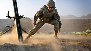 Pfc. Josh Barrios, a mortarman from Torrence, Calif., working with B Troop, 1st Squadron, 40th Cavalry Regiment, 4th Brigade Combat Team (Airborne), 25th Infantry Division, lunges to a safe distance after firing a mortar during a mission Dec. 16 at Camp Clark in the Khost Province of eastern Afghanistan. (Photo by US Army Pfc. Andrya Hill)