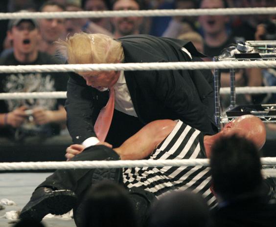 DETROIT - APRIL 1: Donald Trump gets taken to the mat by 'Stone Cold' Steve Austin after the the Battle of the Billionaires at the 2007 World Wrestling Entertainment's Wrestlemania April 1, 2007 at Ford Field in Detroit, Michigan. (Photo by Bill Pugliano/Getty Images)